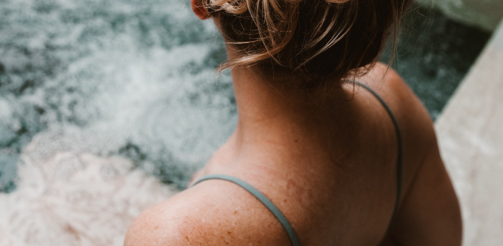 Woman sat in hot tub